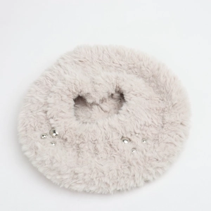 Close-up of soft faux rabbit fur texture with silver studded bead accents on the hat