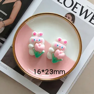 Detail showing 16x23mm resin rabbit charm holding a tulip for DIY hair accessories
