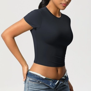 Close-up of black slim fit cropped sports t-shirt with crew neck and elastic fabric