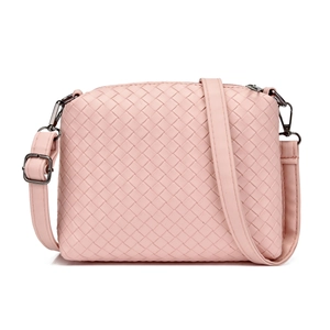 Detailed view of pink woven texture crossbody bag with dark metal zipper and adjustable strap