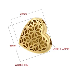 Macro detail of a 21mm hollow heart bead with hexagonal patterns for DIY jewelry