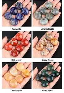 Macro detail of various polished natural crystal cat paw carvings in six different gemstones