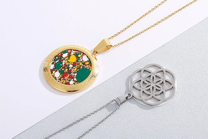 Detail of gold mosaic pendant with Greek fret and silver hollow flower crystal necklace