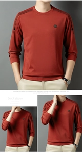 Detail des ziegelroten Langarmshirts mit Schulterstreifen und Brustabzeichen-Dekor