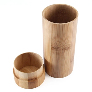 Cylindrical bamboo sunglasses case with natural wood grain texture and matching lid