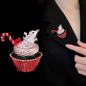 Christmas snowman ice cream brooch with enamel cane, worn on a black suit lapel