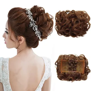 Detail of synthetic brown wavy hair bun extension with built-in comb for bridal styling