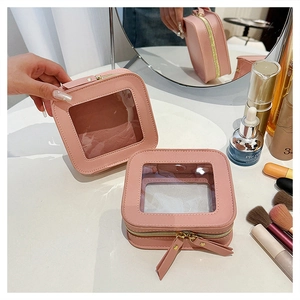 Pink square cosmetic bag with transparent window, portable makeup storage pouch for women.