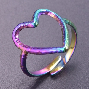 Macro view of rainbow iridescent heart-shaped open ring with unique hammered texture