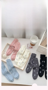Detailed view of combed cotton star pattern mid-calf socks in five assorted colors
