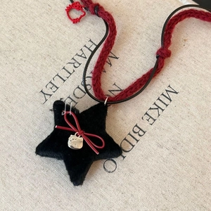 Star pendant necklace with red bow and black woven rope for autumn winter daily outfits