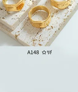 Detail view of irregular hammered gold-plated rings with textured surface on stone