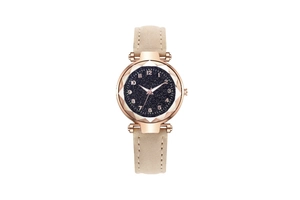 Close-up of starry blue dial and rose gold geometric case with beige leather strap