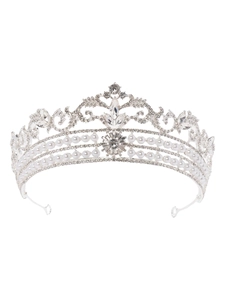 Detailed view of alloy bridal crown featuring intricate filigree, pearls, and rhinestones