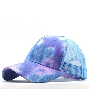 Side view of tie-dye baseball cap with blue mesh back and curved brim detail