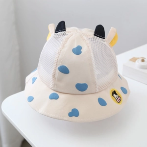 Detail of baby sun hat featuring breathable mesh crown and cute cartoon cow 3D horns