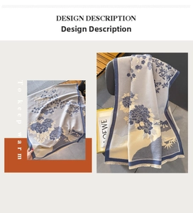Detail of floral landscape pattern on thick grey cashmere-like winter scarf with blue trim