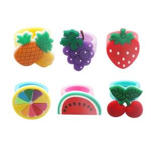 Close-up of colorful silicone fruit rings featuring strawberry watermelon and grape patterns
