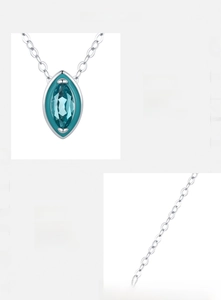 Detail of 925 sterling silver necklace featuring 5A marquise-cut blue cubic zirconia