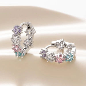 Silver star huggie hoop earrings with colorful zircon stones in purple, pink and blue