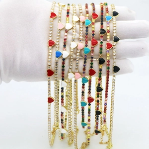 Close-up of multicolored enamel heart tennis bracelets with CZ stones and lobster clasp