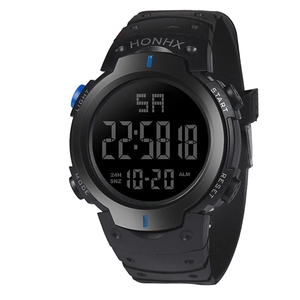 Digital sports watch detail showing LCD display with date, week, and blue function buttons