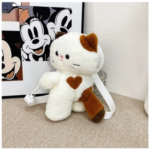 Detail of cute tricolor calico cat plush bag with brown heart and white strap