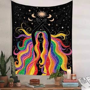 Artistic tapestry with colorful female silhouette and moon phases hanging over a wooden table