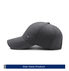 Side view of dark gray business baseball cap with metallic logo and textured knit fabric