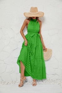 Detail of the bright green checkered fabric texture on this summer halter neck dress