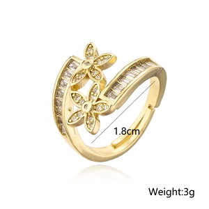 Macro detail of gold flower ring featuring clear cubic zirconia and dimensions