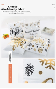 Detail of Christmas pillowcase showing gold foil snowflake print on soft white fabric