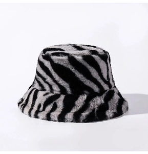 Close-up detail of plush zebra print fabric texture on a thick winter bucket hat