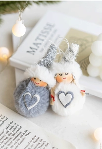Macro detail of wool felt gnome ornaments with wooden faces and knitted heart hats