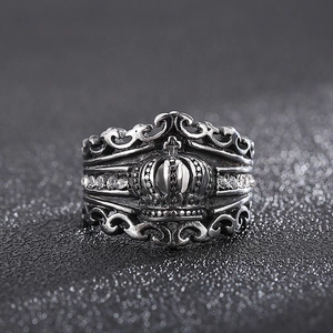 Close-up of retro silver crown ring featuring gothic cross and zircon embellishments