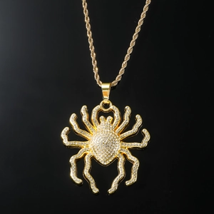 Gold iced out spider pendant necklace with crystal rhinestones on a twisted rope chain