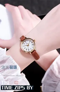 Elegant ladies quartz watch with brown leather strap and gold Roman numeral dial