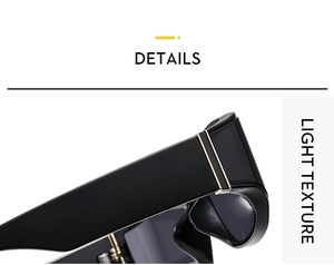 Macro detail of high-gloss black sunglasses frame with gold hinge and light texture