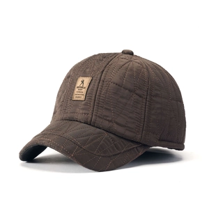 Quilted brown winter baseball cap for elderly men with warm ear flaps and leather patch