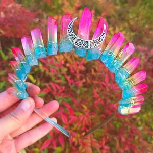 Macro detail of handmade Wicca crystal crown with colorful gradient stones and moon charm