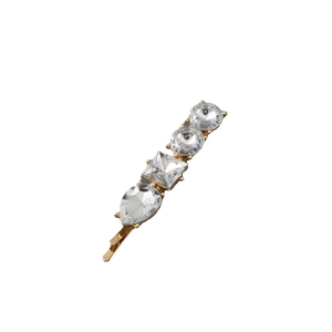 Detail of gold metal hair clip featuring square and water-drop shaped crystals