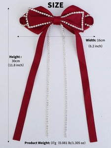 Detail showing red velvet bow hair clip dimensions with rhinestone and long ribbon