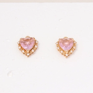 Detail of pink heart zircon pendant with gold metal base for DIY jewelry making