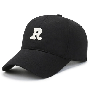 Black cotton baseball cap with white 3D letter R embroidery in a classic 6-panel style