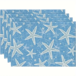 Close-up of blue placemats with white starfish print in a durable woven fabric texture