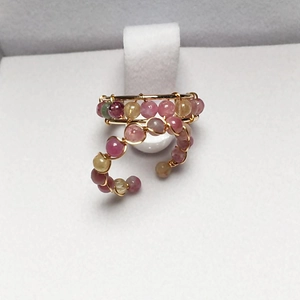 Detail of handmade 14K gold filled wire wrapped ring with colorful tourmaline beads