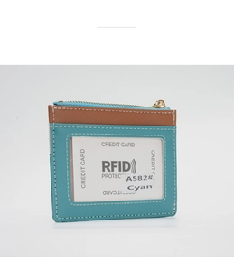 Detail of RFID blocking PU leather wallet in cyan and brown with a transparent card slot