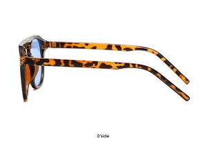 Detail view of tortoiseshell sunglasses frame with light blue lenses from a side angle