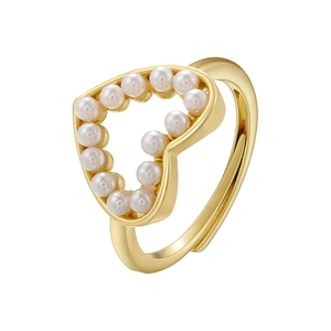 Close-up of heart shaped ring with white pearls and adjustable gold metal band