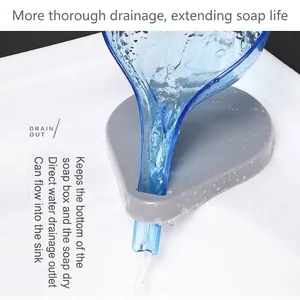 Leaf-shaped soap dish with suction cup base and automatic drainage system for bathrooms